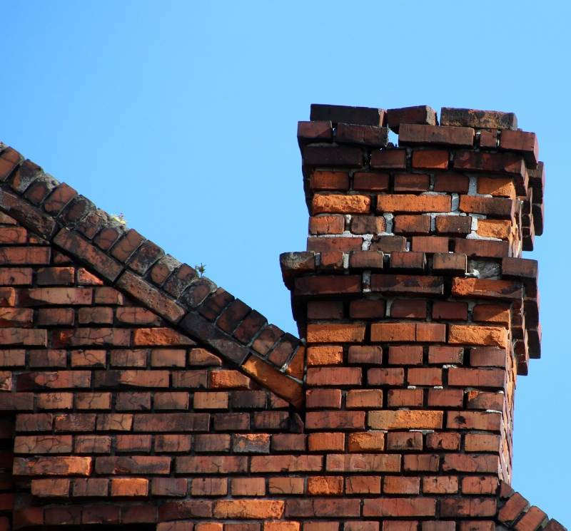 Blog Article - Damaged chimney on an La Grange home showing cracks and missing mortar